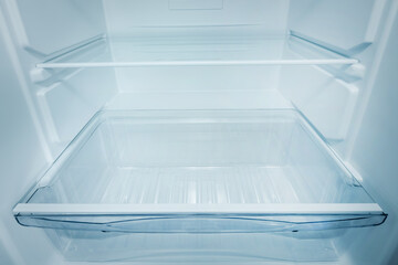 Refrigerator open empty fridge inside interior. close up on empty refrigerator with door open. New clean refrigerator
