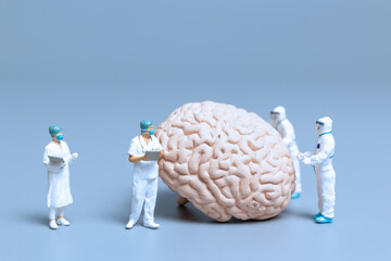 Miniature Doctor checking and analysis alzheimer's disease and dementia of brain, Science and...