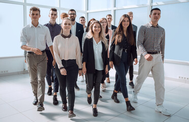 Fototapeta premium group of ambitious young people enter a new office