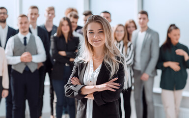 ambitious young business woman standing in front of her colleagues