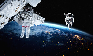 Astronaut spaceman do spacewalk while working for space station in outer space . Astronaut wear full spacesuit for space operation . Elements of this image furnished by NASA space astronaut photos. © InfiniteFlow