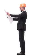 businessman in helmet looking at new drawings . isolated on white