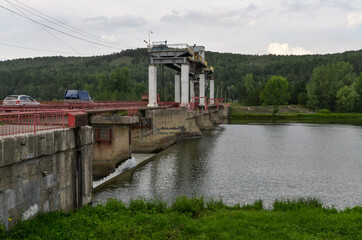Fototapeta na wymiar dam on Chulym river in Nazarovo (Krasnoyarsk Krai, Russia)