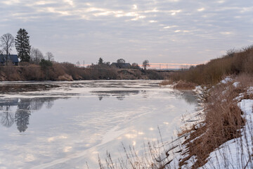 Fototapeta na wymiar winding river that is still frozen