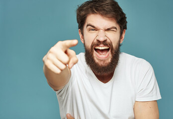 joyful man touching his head with his hands happiness emotions blue background