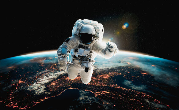 Astronaut spaceman do spacewalk while working for space station in outer space . Astronaut wear full spacesuit for space operation . Elements of this image furnished by NASA space astronaut photos.