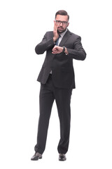Fototapeta premium full length . Executive businessman looking at his wristwatch
