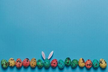 painted eggs on a blue background for easter