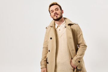 man in beige coat fashionable hairstyle attractive look Studio