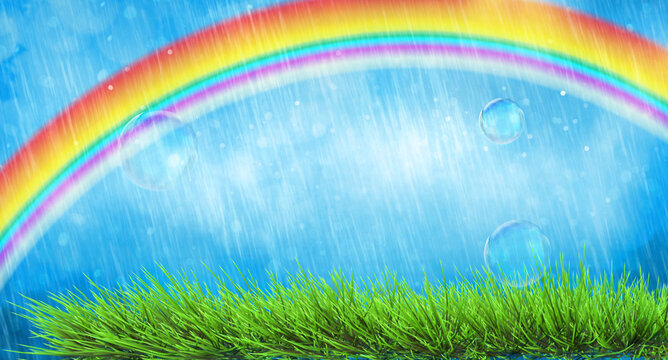 vivid spring landscape with rainbow and green grass