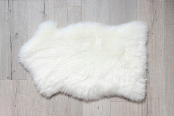 here's a sheep skin on the floor. Top view, copy space