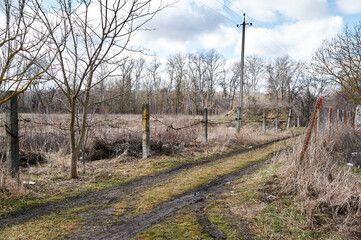 Old rural street in early spring in cis countries