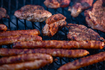 roasted chicken and pork steak with sausages. grilled meat cooked and smoked