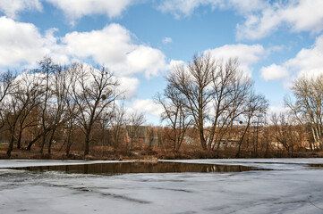 Thin ice on the river in early spring