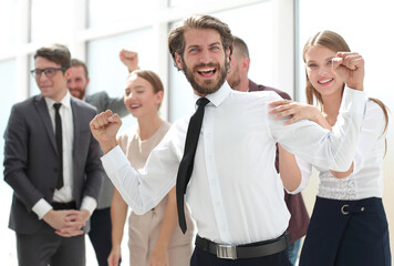 happy young businessman on business team background.