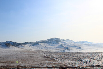 Fototapeta na wymiar Scenic Snowcapped Mountains View and Snow Valley in Siberia 