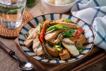 Homemade stir-fried dried beancurd with dried fish and green chili.