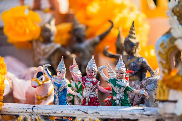 Vintage figurine of traditional Thai ceremonial dancer in temple Thailand