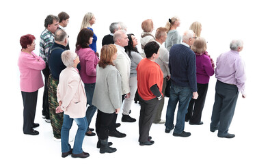 Obraz premium group of diverse elderly people standing in front of a closed door