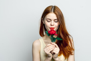 smiling woman holding rose flower in hands charm red lips attractive look isolated background