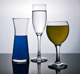 glass of wine isolated in black and white image ,full wine in glass on dark background ,different glass together
