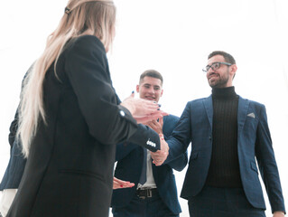 businessman and businesswoman shaking hands with each other
