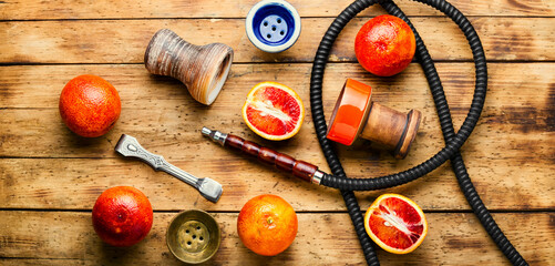 Traditional oriental hookah with orange tobacco © nikolaydonetsk