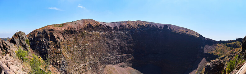 Mount Vesuvius in South Italy on a sunny day, volcano crater next to Naples in a summer. .