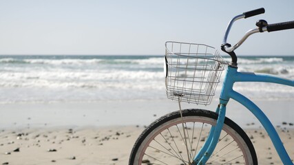 Blue bicycle, cruiser bike by ocean beach pacific coast, Oceanside California USA. Summertime...