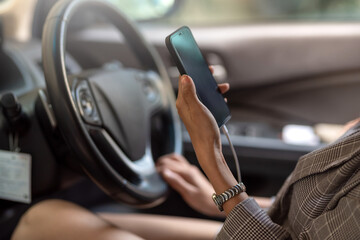 Woman using a smartphone while driving danger.