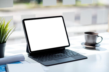 Fototapeta premium Digital tablet blank white screen on the desk. Mock up.