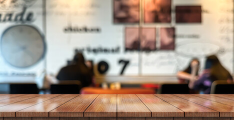 Empty wooden table top with lights bokeh on blur restaurant background.