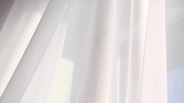 wind blows through the open window in the room. Waving white tulle near the window.