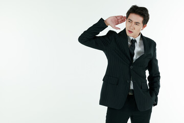 Portrait of self-confidence young and handsome Asian businessman in black suit standing and raise hands ready for hearing and listening, copy space studio shot isolated on white background