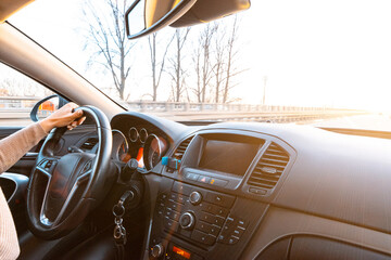 Driver car. Fun drive in winter vacation ride day. Happy young woman have road travel trip inside car in sunny day.