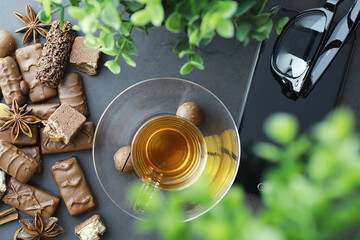 Chocolate bars on a black background in backlight. Chocolate with filling. Sweet sweets for snack and tea.