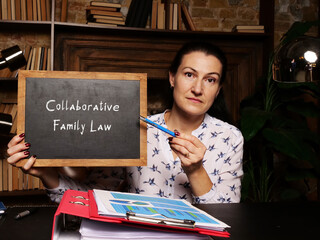 Fototapeta premium Business concept about Collaborative Family Law with sign on chalkboard in hand.