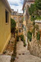 Fototapeta na wymiar The island of Corfu. Streets of the city of Kerkyra, Ancient architecture. Summer landscape.