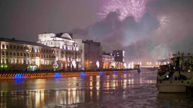 View of fireworks in Moscow at New Year night over river. Hoildays in big city