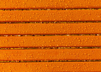 Warm brown table top in raindrops.