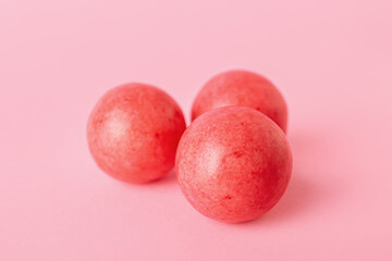 Tasty chewing gums on color background