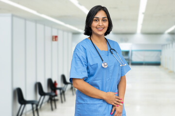 Laughing nurse at vaccination station is ready for vacinating patients against coronavirus infection