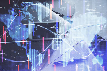 Double exposure of business theme hologram over desktop with phone. Top view. Mobile international trade connection concept.