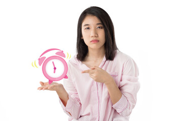 woman holding alarm clock feeling sleepy