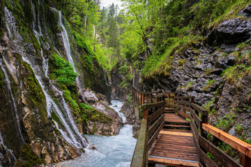 A lot of Waterfalls in the Wimbacklamm in Bavaria Berchtesgaden with stones and green plants and trees