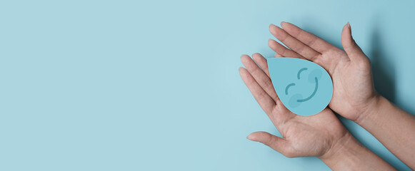 Woman hand holding smile water drop paper cut, world water day, clean water and sanitation, hand...