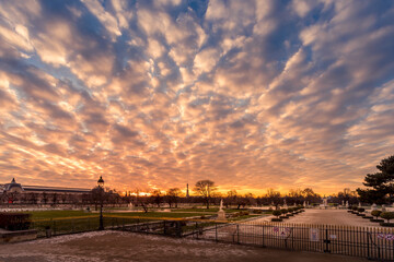 Paris, France - February 12, 2021: Tuileries Garden in Paris covered with snow at beautiful sunset