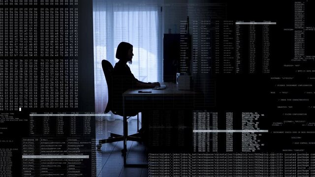 Female internet hacker sits at computer in dark room and gains access to secured data. Digital code binary data overlays.