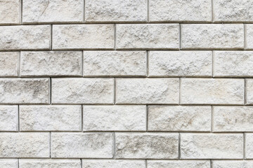 A wall made of gray bricks.
