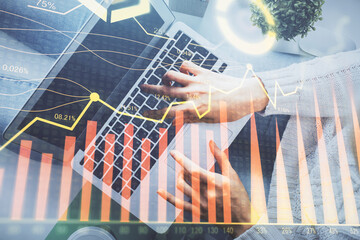 Double exposure of woman hands working on computer and forex chart hologram drawing. Top View. Financial analysis concept.